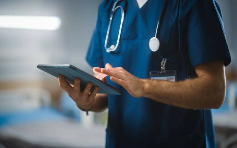 Unrecognizable Head Nurse, Doctor, Surgeon Uses Digital Tablet Computer