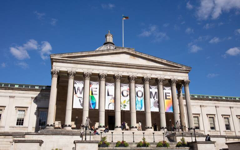 Photo of the Wilkins Building from the UCL Quad - a welcome banner is displayed