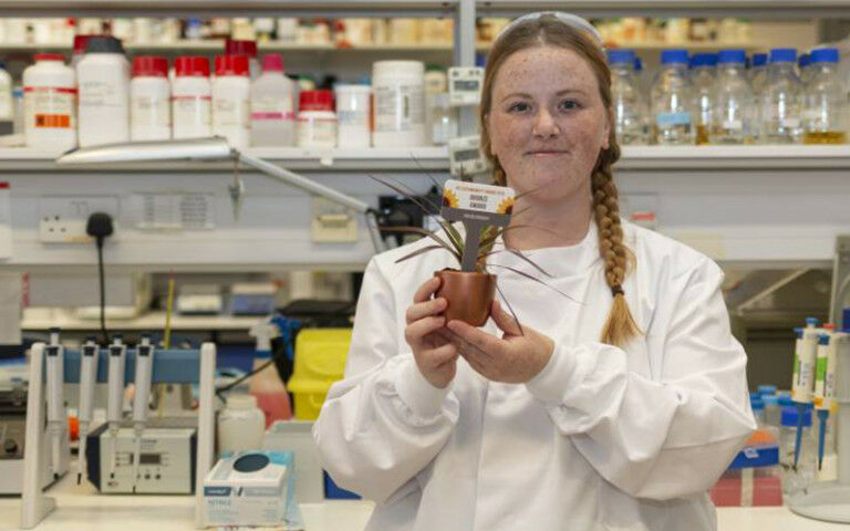An image of a women holding up a LEAF bronze award - Credit: LEAF