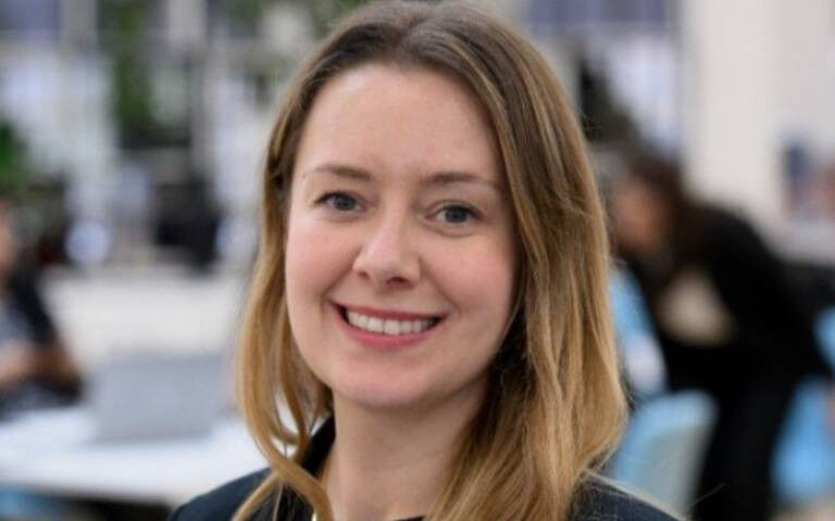 Jayne Watson looking directly at the camera with a smile.