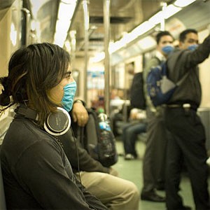 Masked train passengers in Mexico City during 2009 Swine Flu outbreak (credit: E