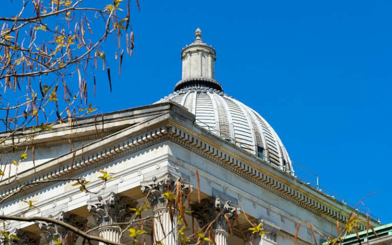 A close-up view of the dome and pillars on the Portico building, with the branch